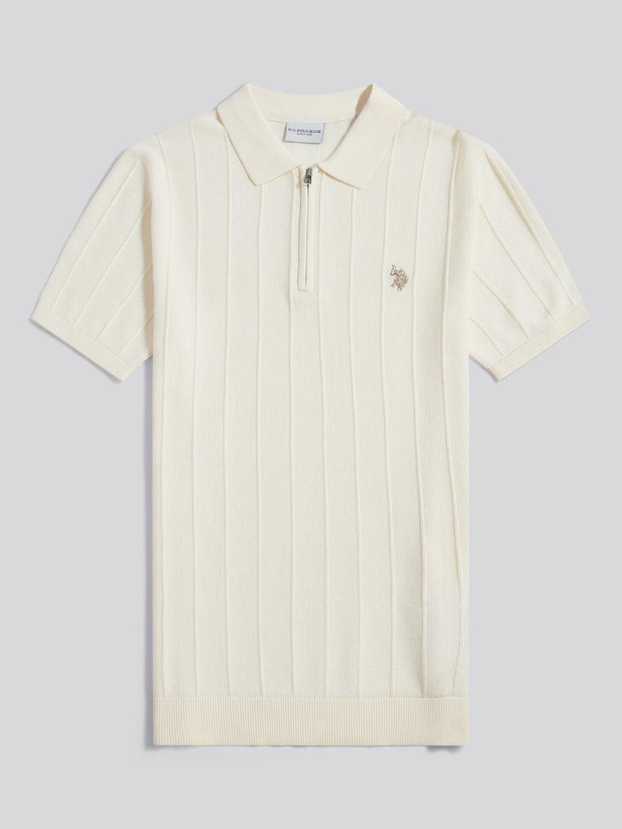 Cream-colored polo shirt with a small logo on a light gray background
