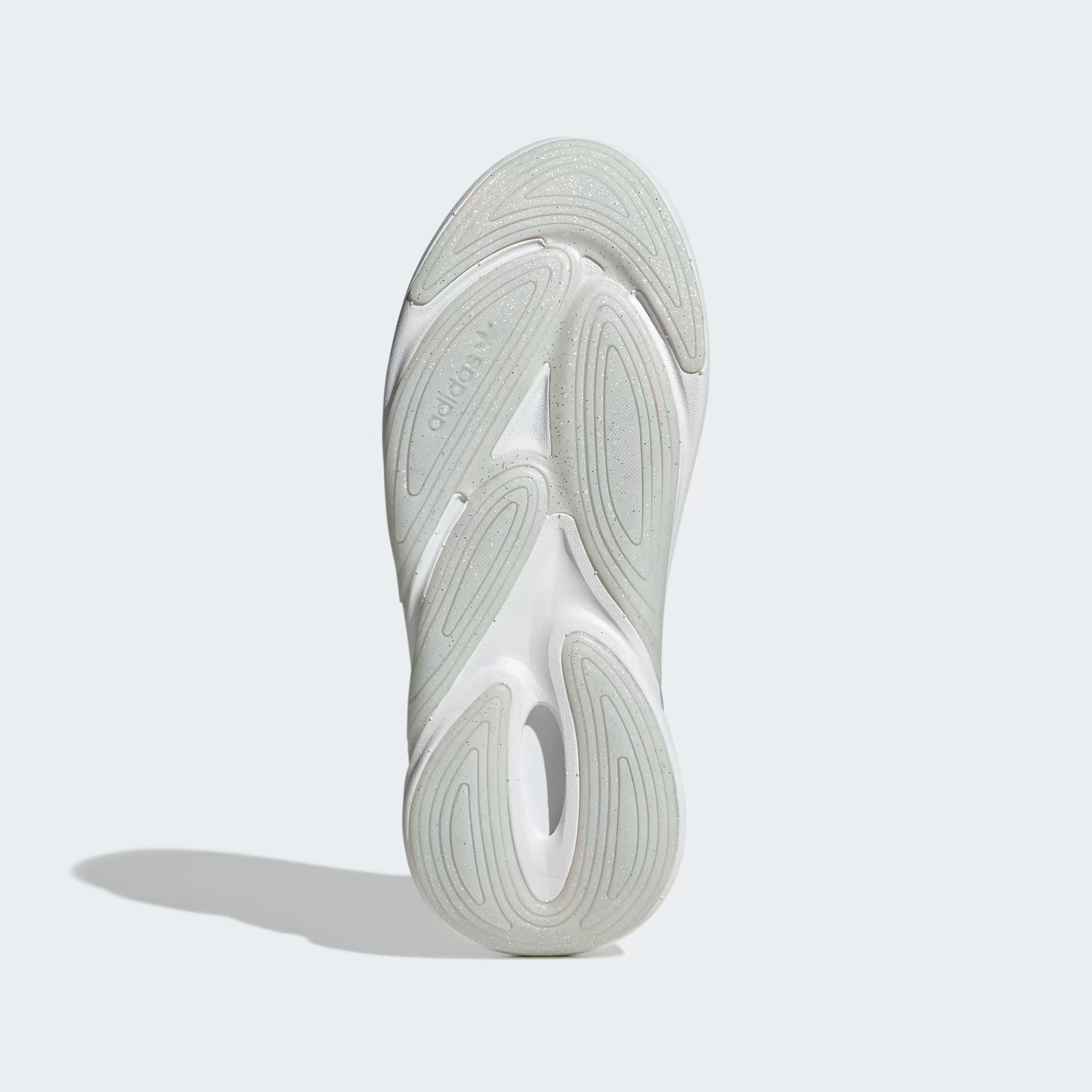 Close-up of a white athletic shoe sole on a light gray background