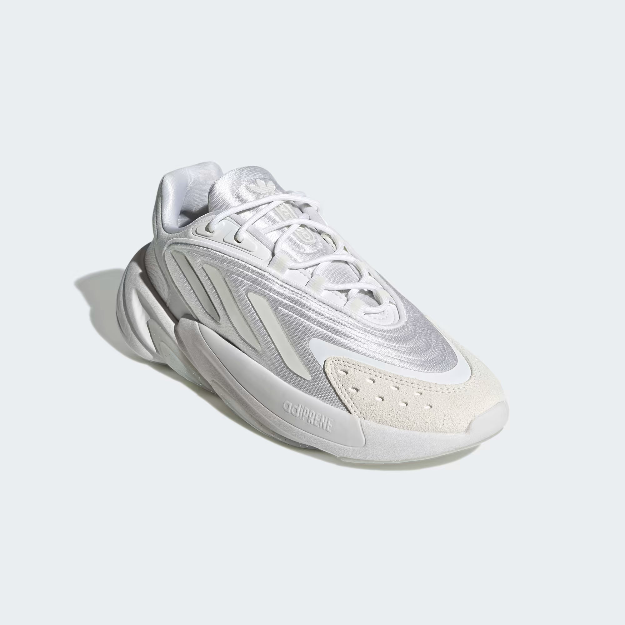 White Adidas sneaker on a light gray background