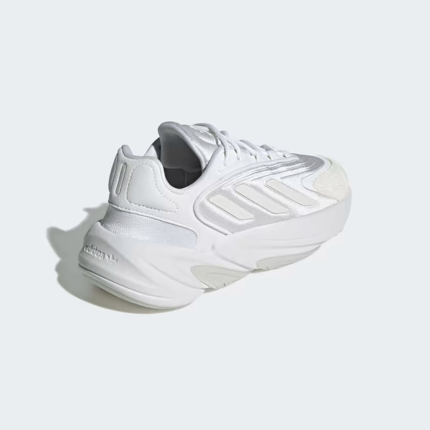 White Adidas sneaker on a light gray background