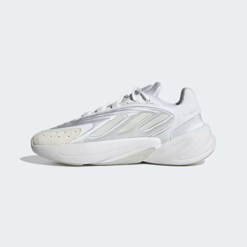White Adidas sneaker on a light gray background