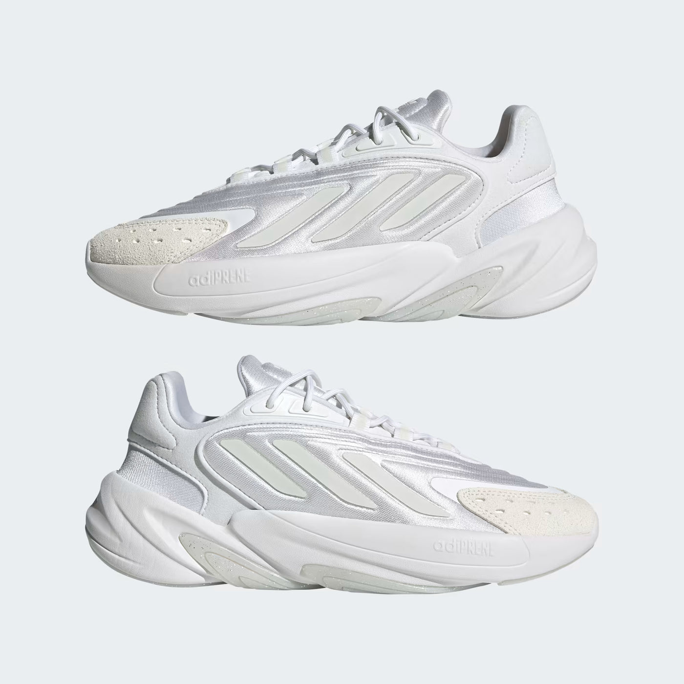 White sneakers with a brand logo on a light gray background