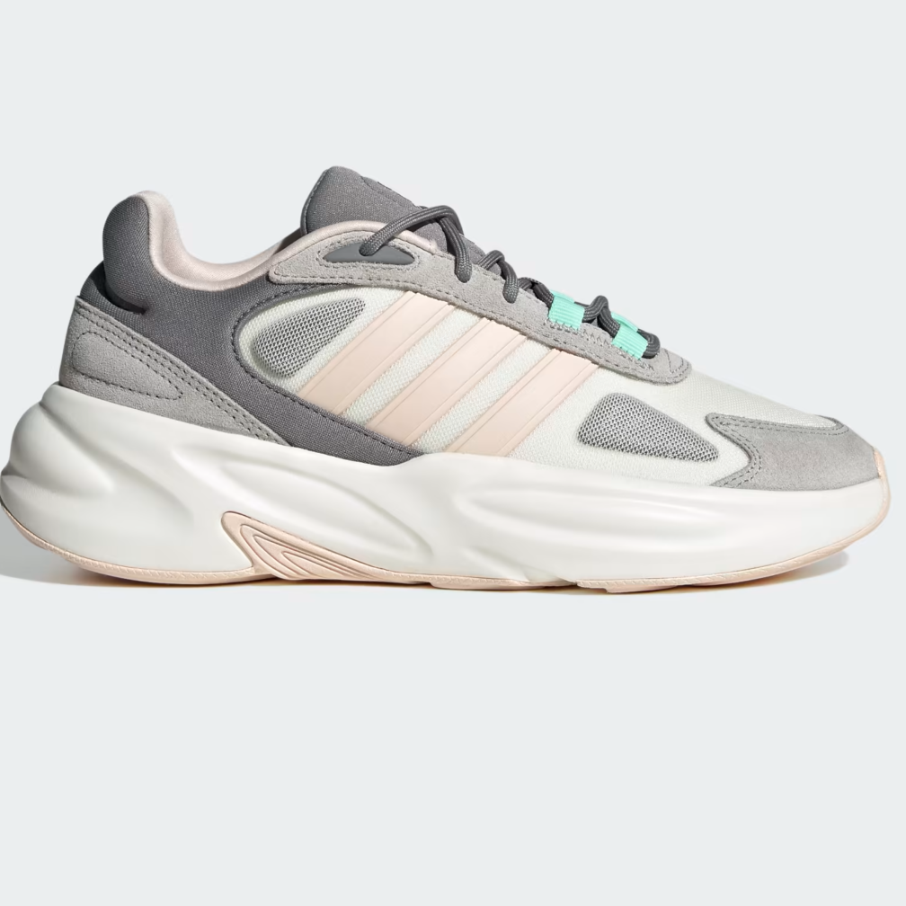 A pair of Adidas Ozelle Cloudfoam Lifestyle Running Shoes in white, gray, and mint green colors with a chunky rubber outsole.