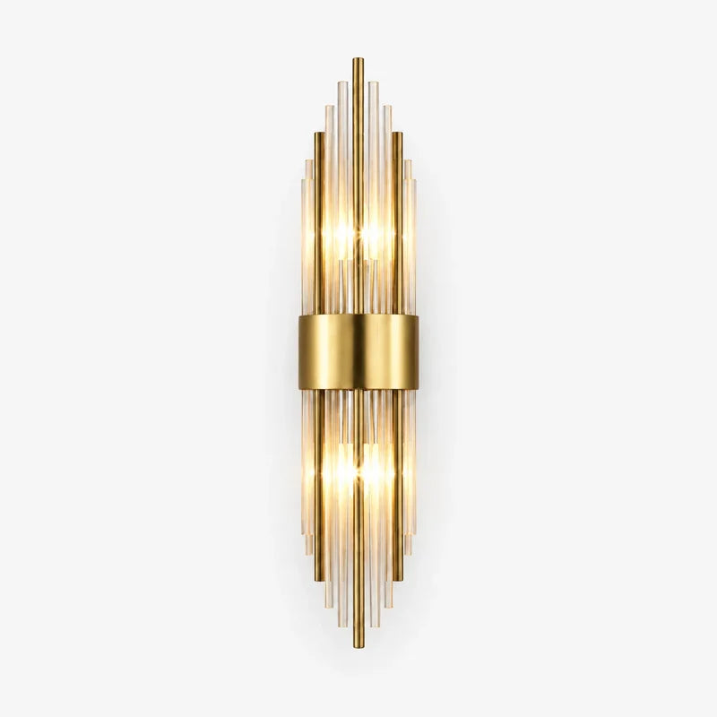 A modern wall-mounted light fixture with multiple vertical clear glass rods and a central gold-toned metal band, shown against a plain light gray background.