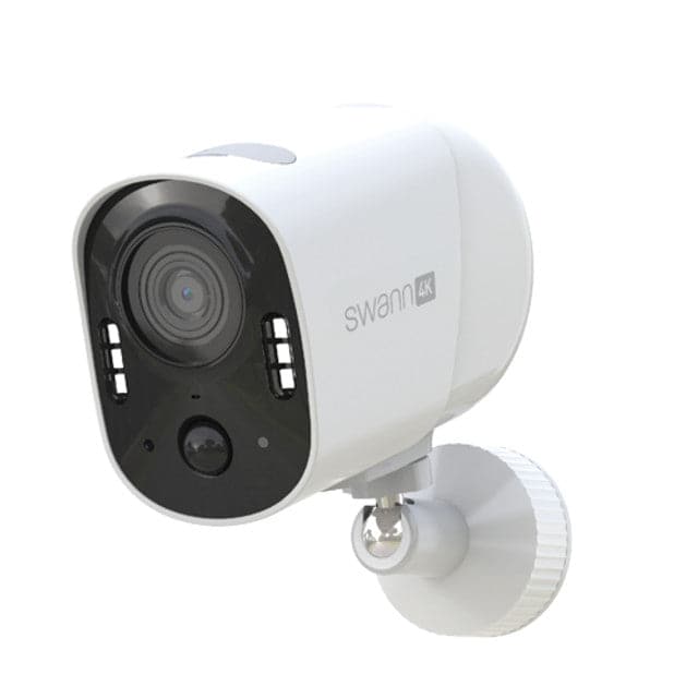White security camera with black lens on a white background
