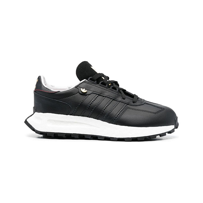Black Adidas sneaker with white sole on a white background