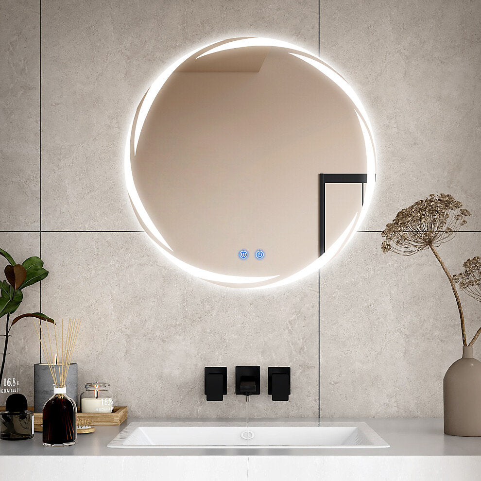 Bathroom with a round illuminated mirror, sink, and decorative elements.
