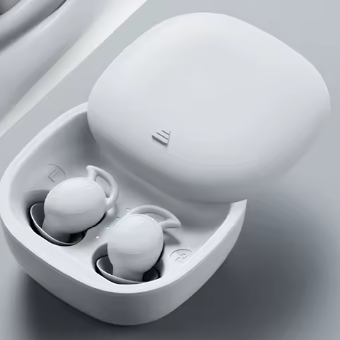 White wireless earbuds in an open charging case on a light gray background