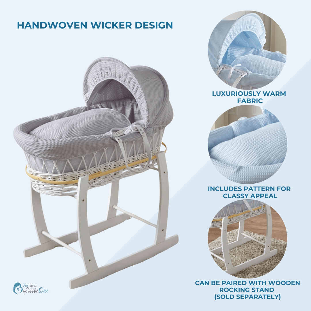 Handwoven wicker baby Moses basket with rocking stand on a light blue background