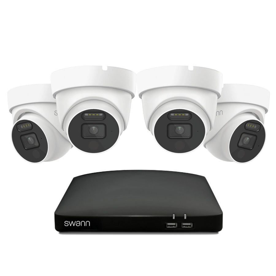 Swann security camera system with four white cameras and a black DVR on a white background