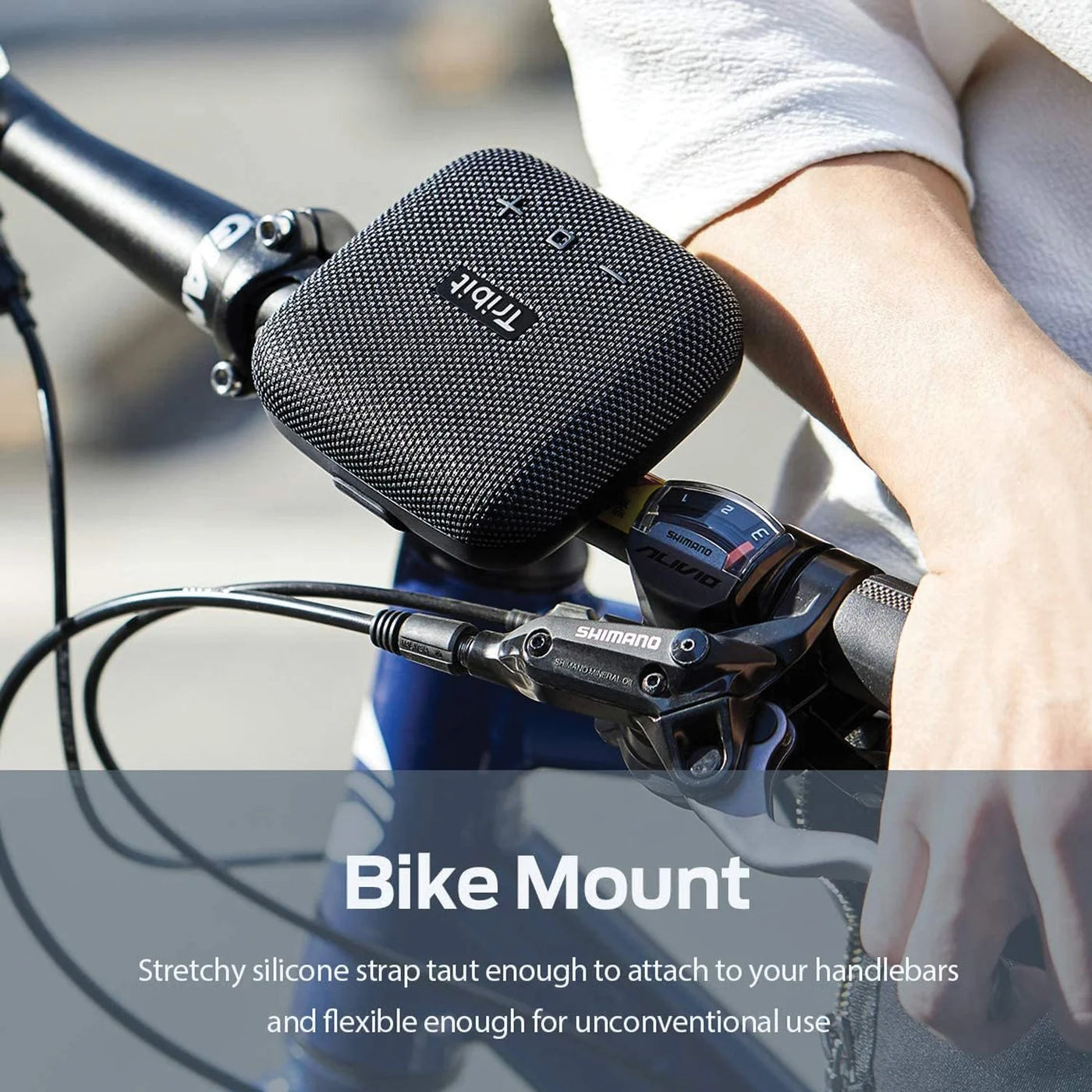 Black bike mount attached to a bicycle handlebar with a person holding it.