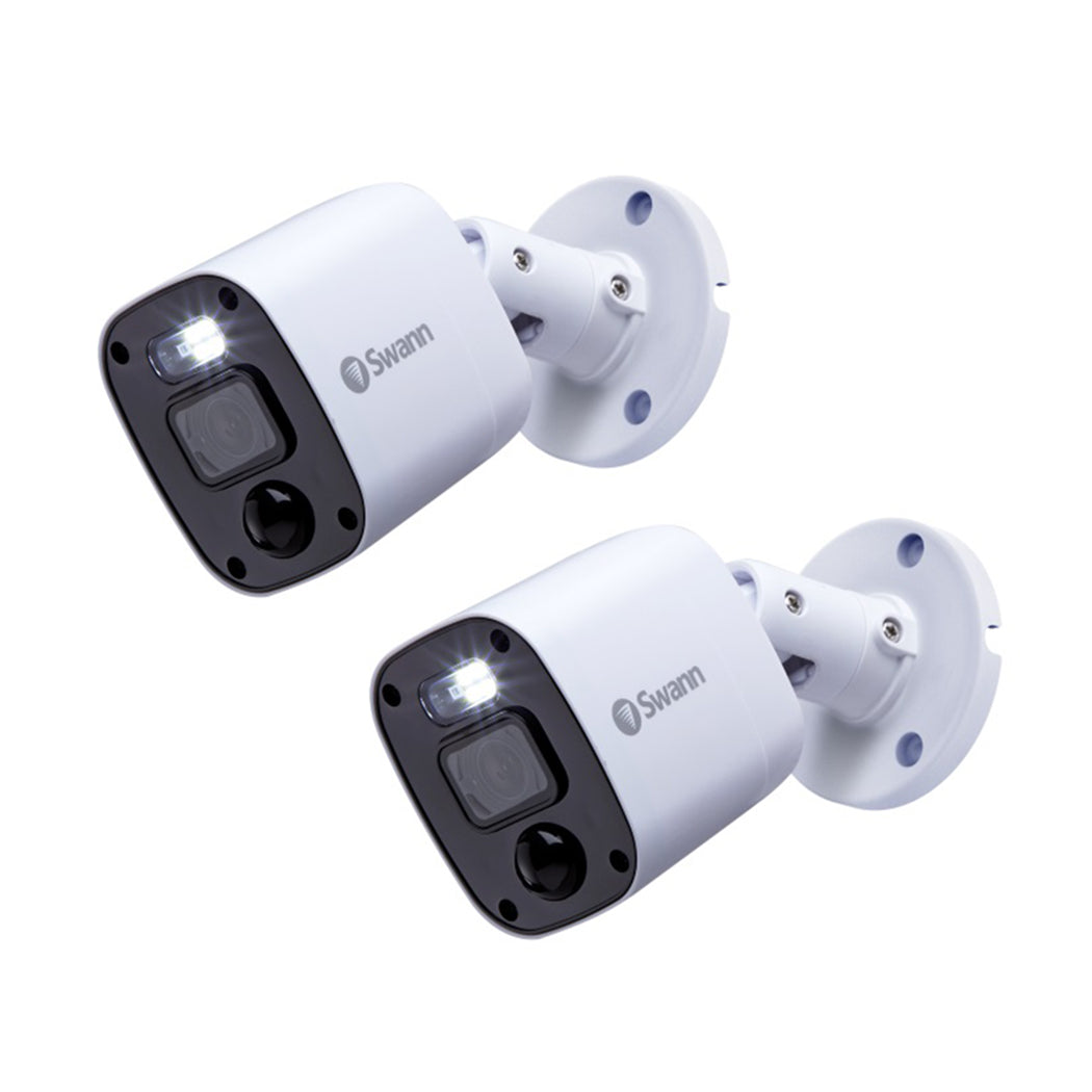 Two Swann security cameras on a white background