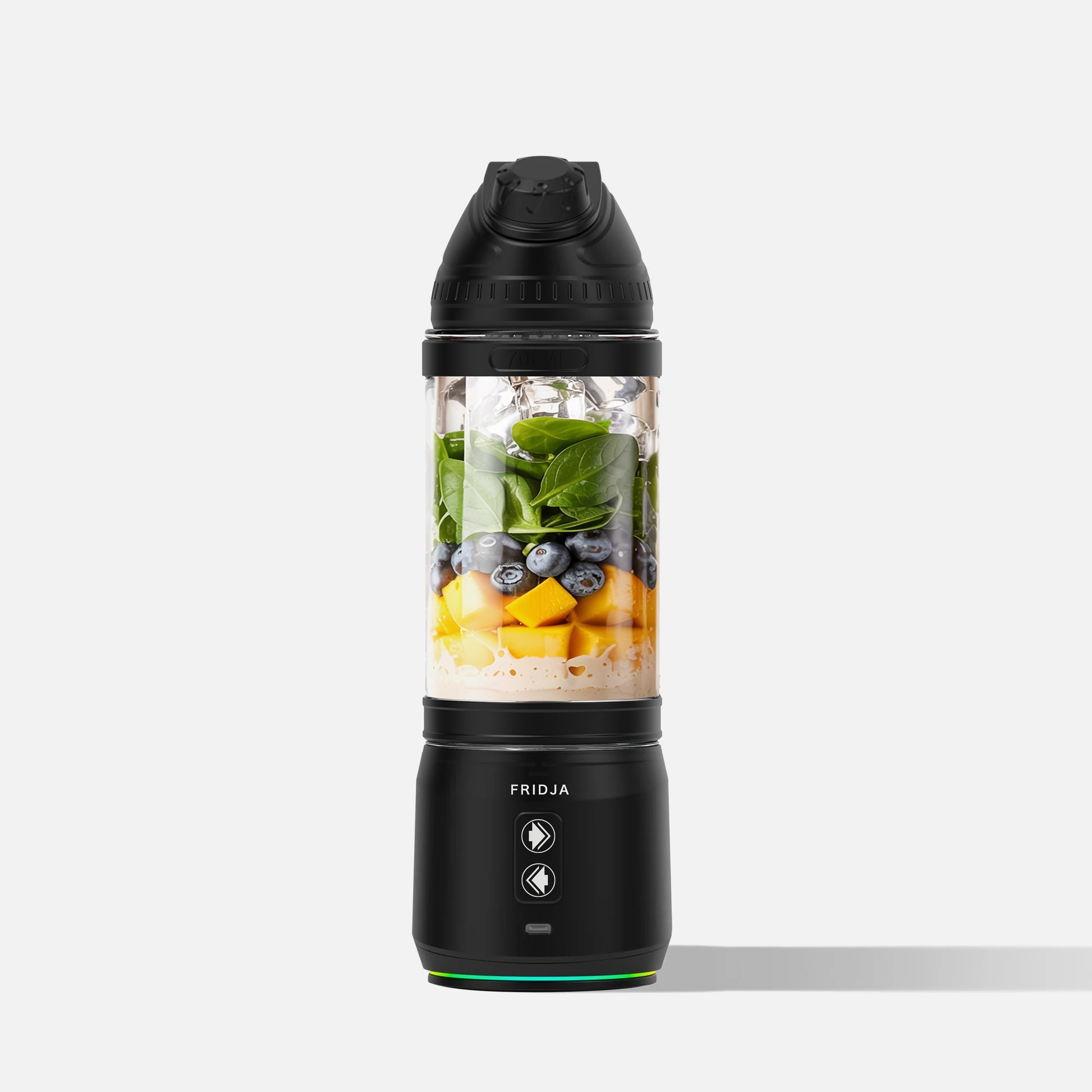 Black portable blender with ingredients inside on a white background