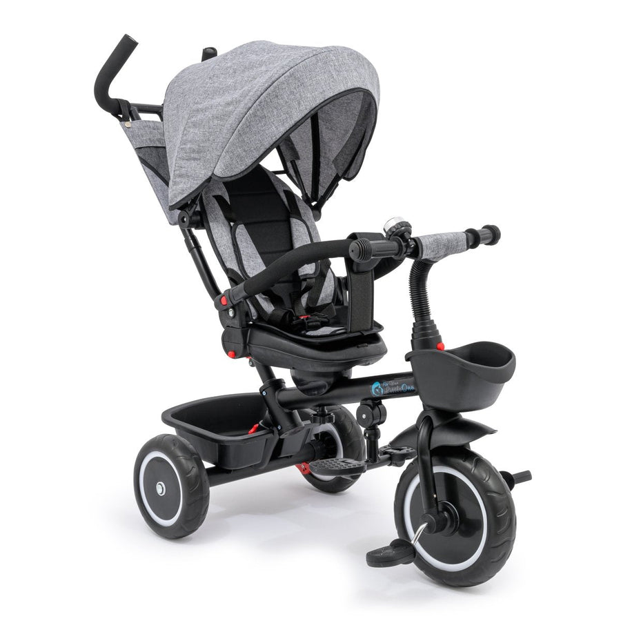 Gray and black baby tricycle with canopy on a white background