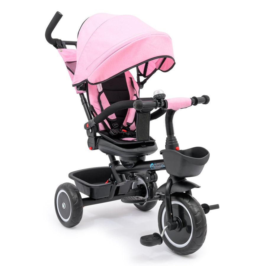 Pink and black baby tricycle with canopy on a white background