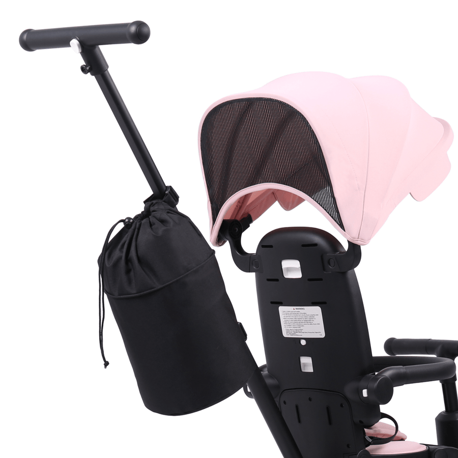 Black baby stroller with pink canopy and black bag attached on a white background