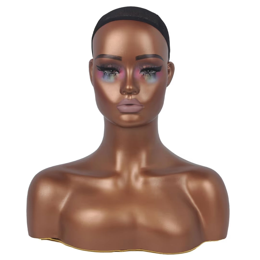 Mannequin head with makeup on a white background