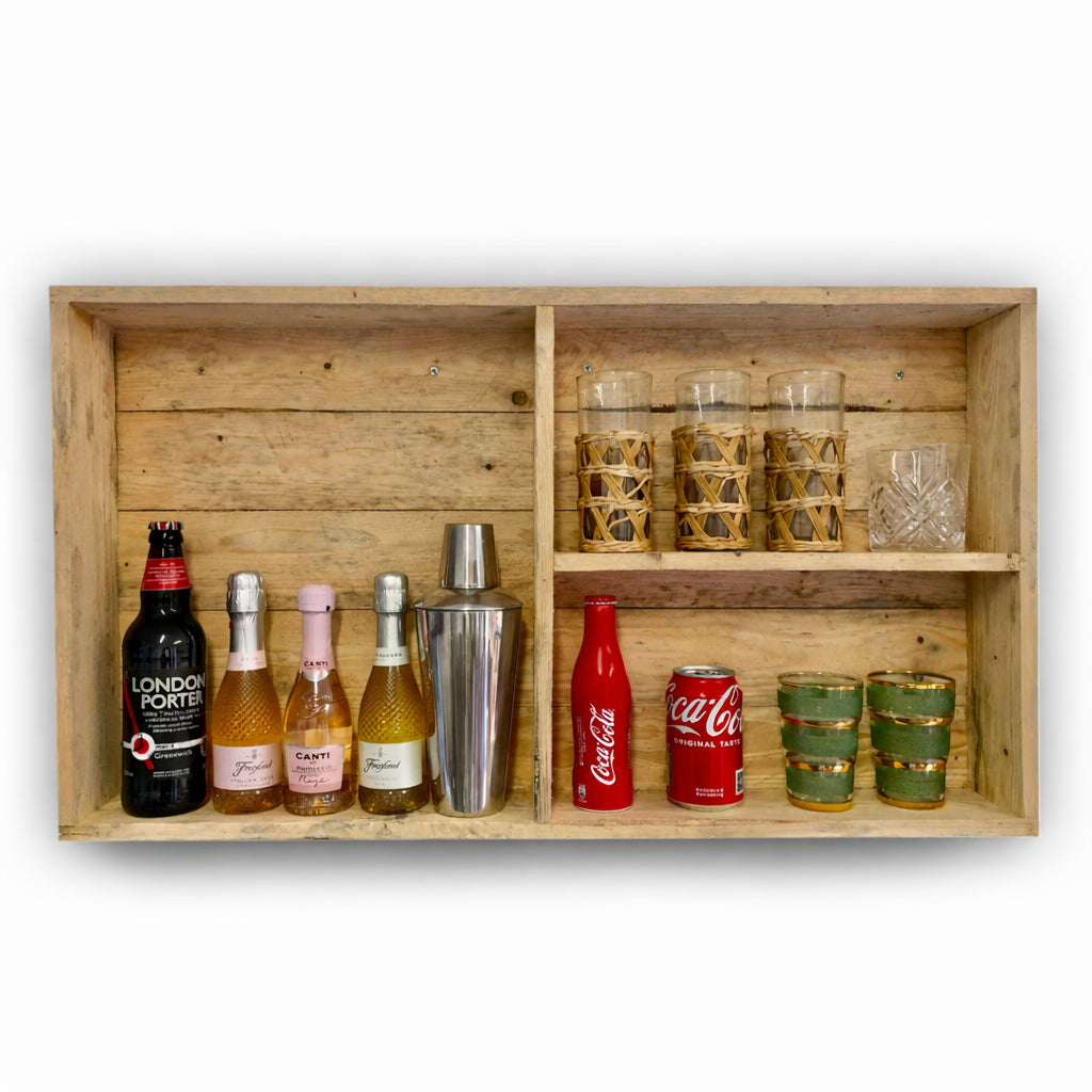 Wooden shelf with various bottles and glasses on a white background