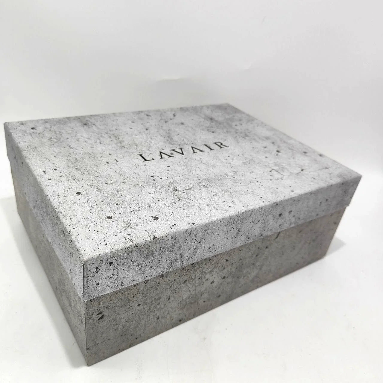 Concrete-like box with 'LAVAIR' branding on a white background