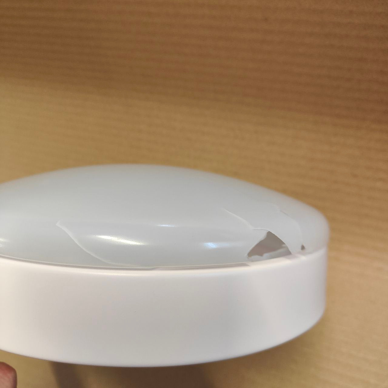 White electronic device on a wooden surface