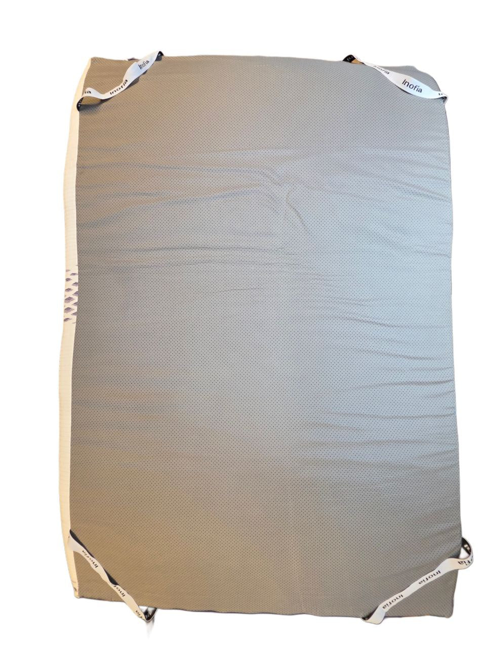Beige mesh laundry bag with white drawstrings on a white background