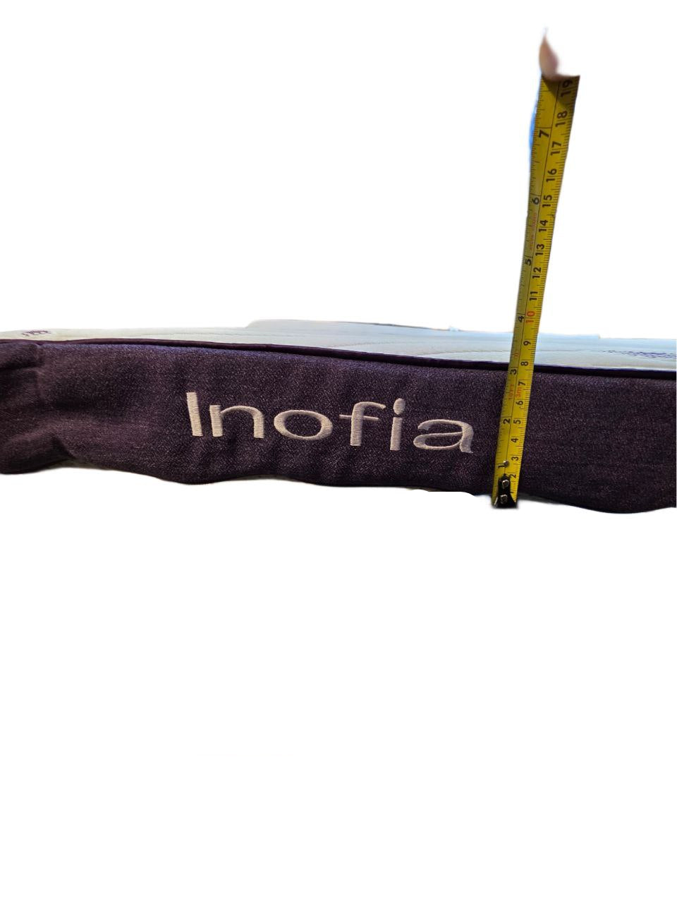 Measurement of a 'Inofia' product with a tape measure on a white background