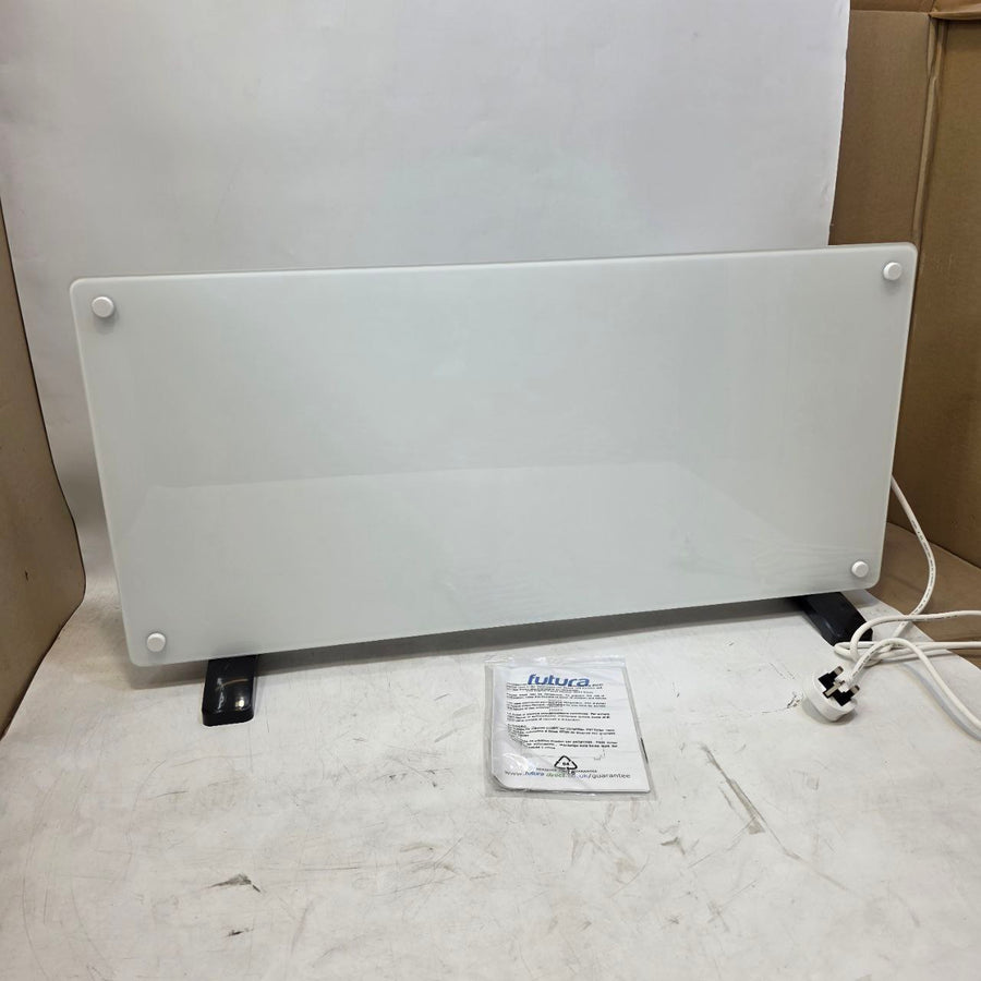 White electric space heater on a white surface with a power cord and packaging label.