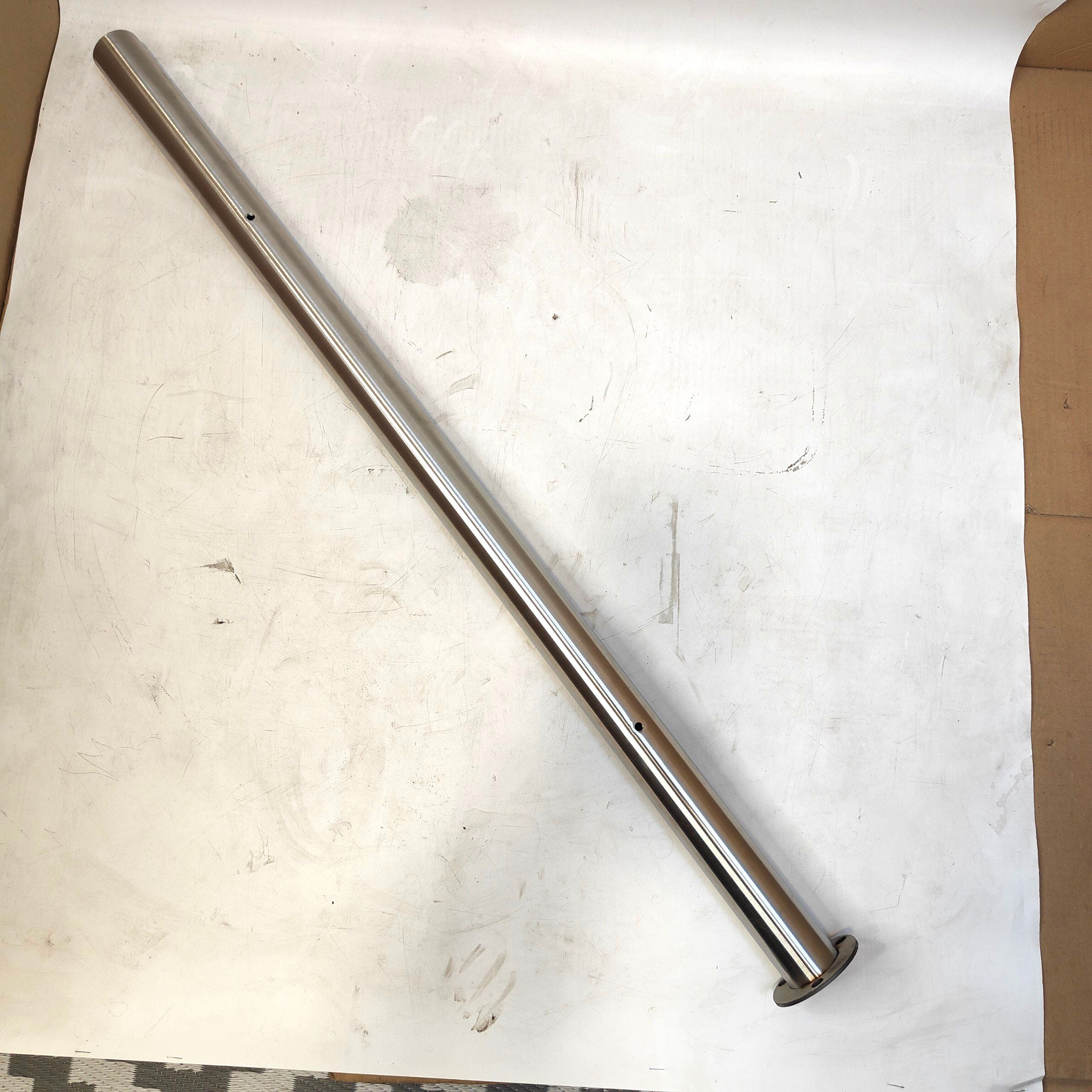 Metal rod on a white surface with cardboard on the side
