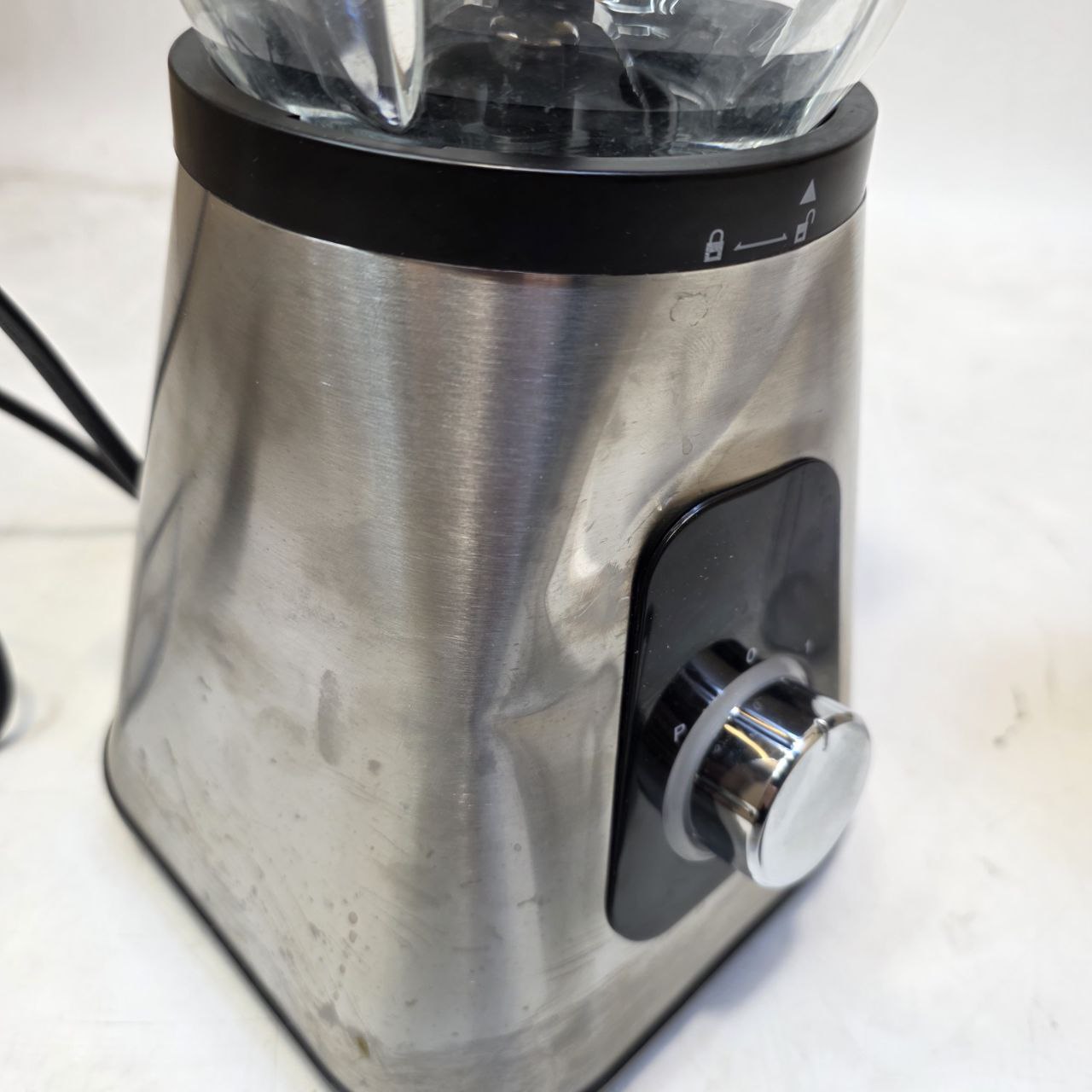 Stainless steel blender on a white surface
