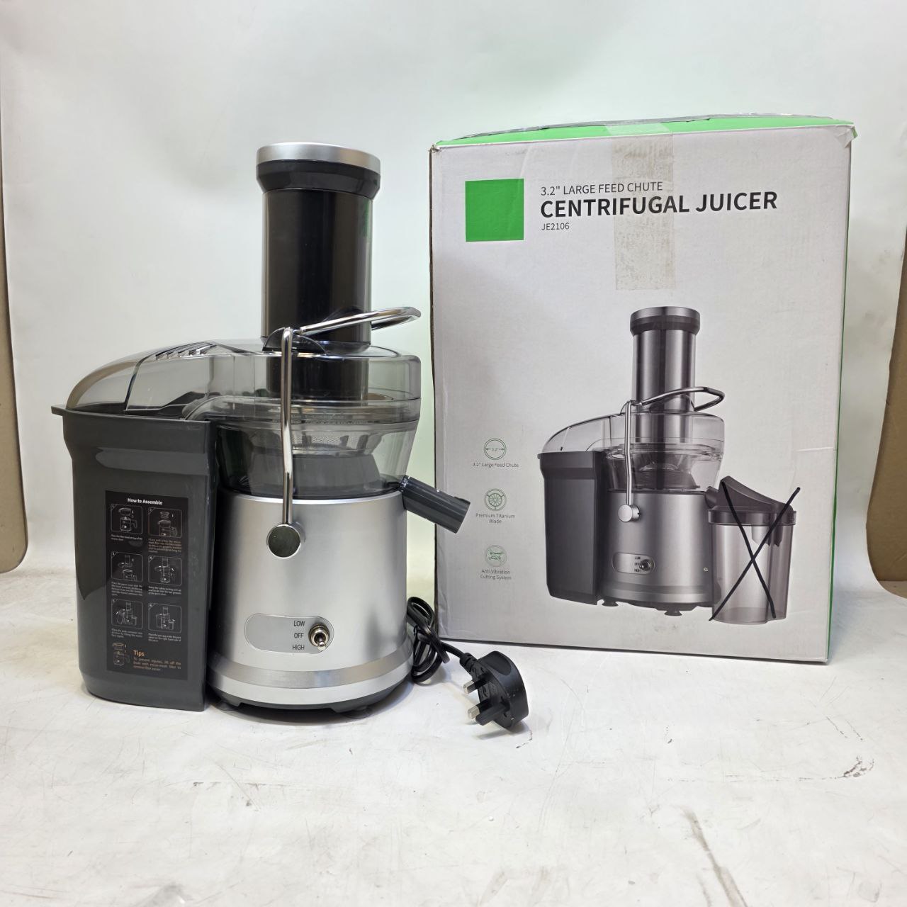 Centrifugal juicer with packaging on a white background