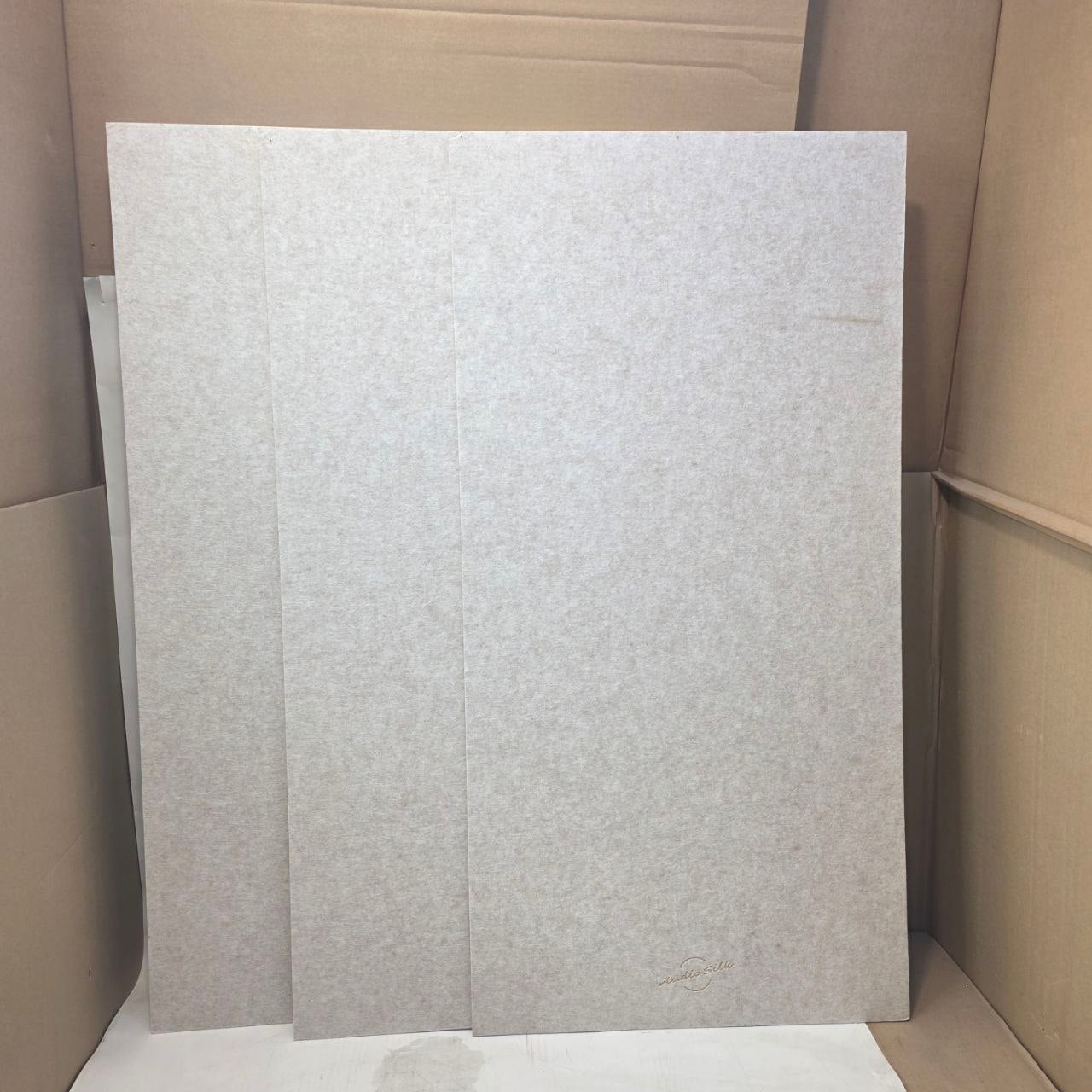 3 beige textured accoustic panels
