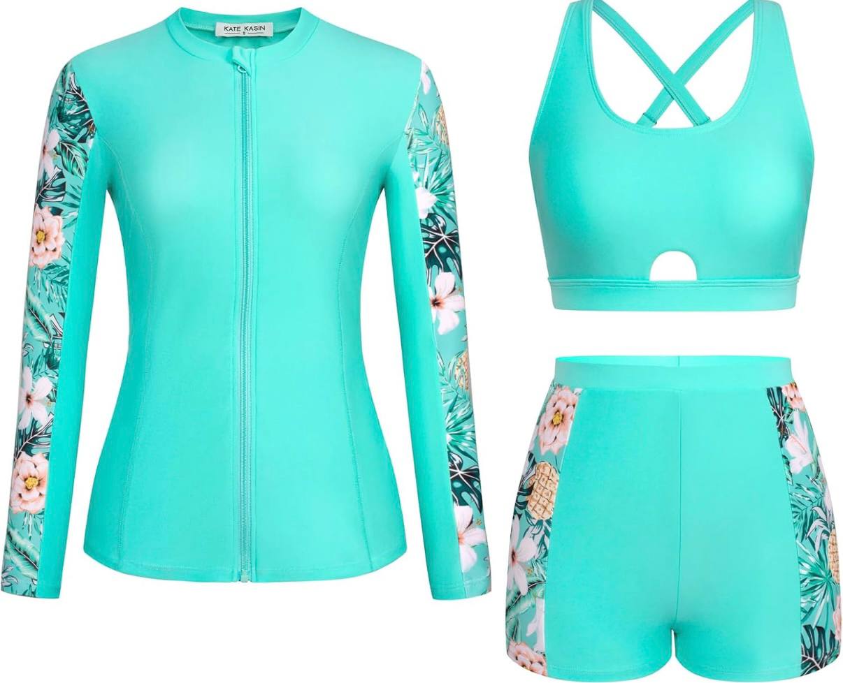 Turquoise swimsuit set with floral patterns on a white background