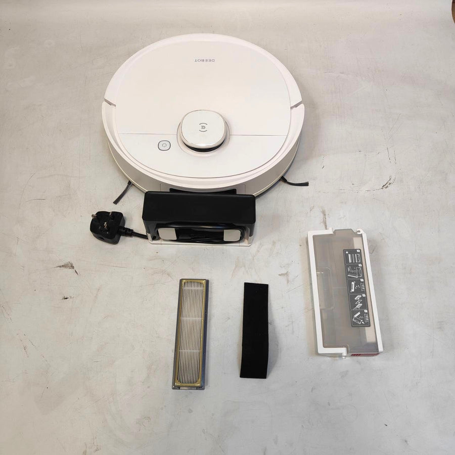 Robot vacuum cleaner with attachments on a concrete floor