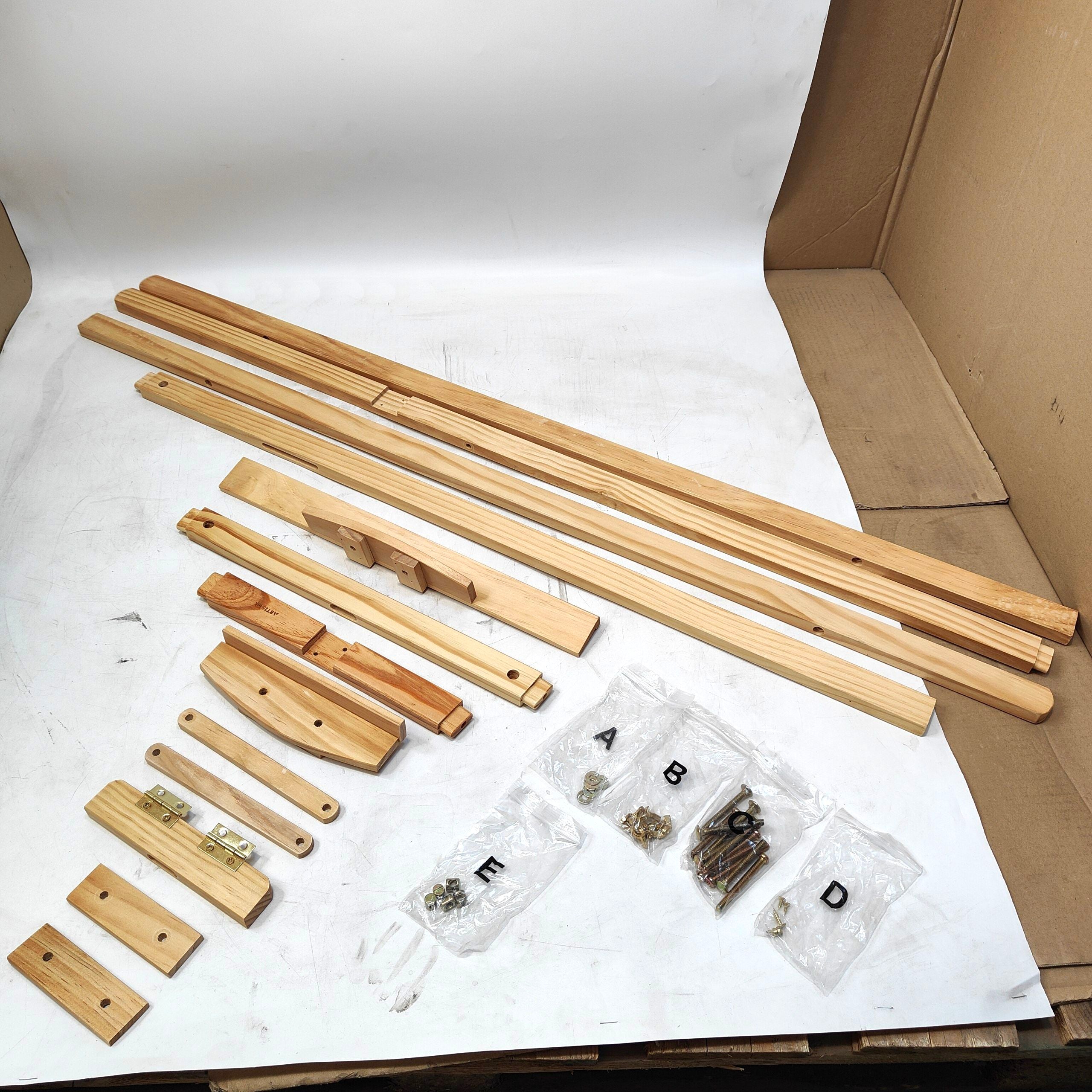 Wooden furniture assembly kit with components and hardware on a white surface.
