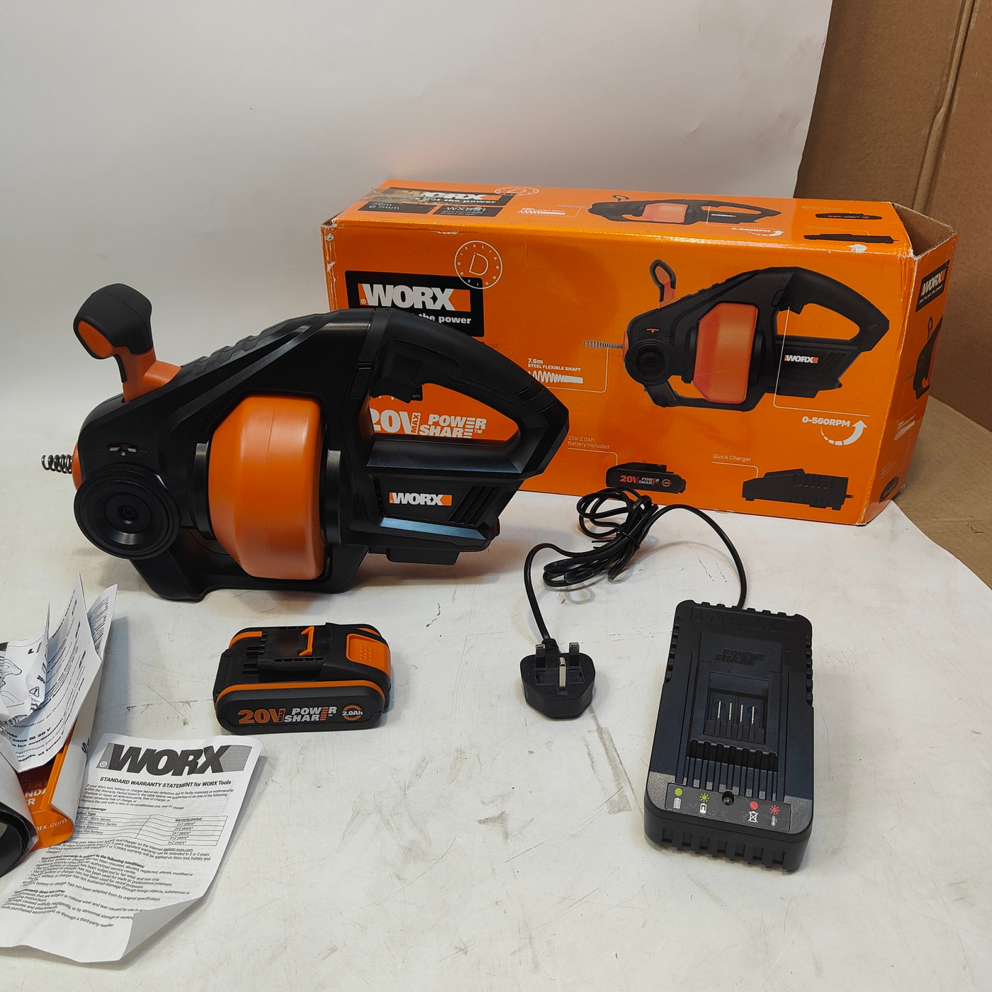 WORX power tool set with tool, battery, charger, and packaging on a white surface.