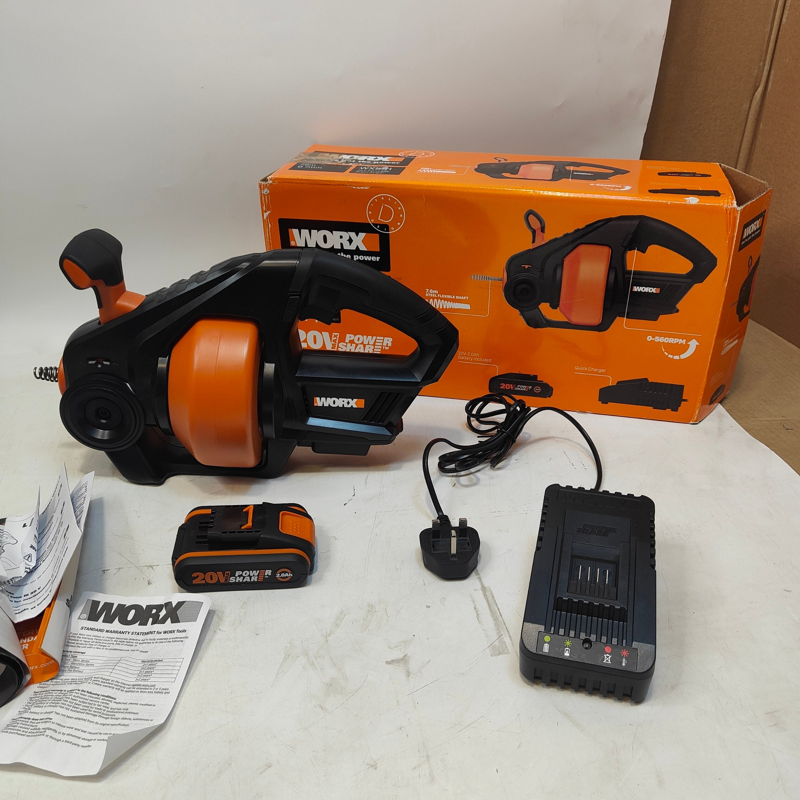 WORX power tool set with tool, battery, charger, and packaging on a white surface.