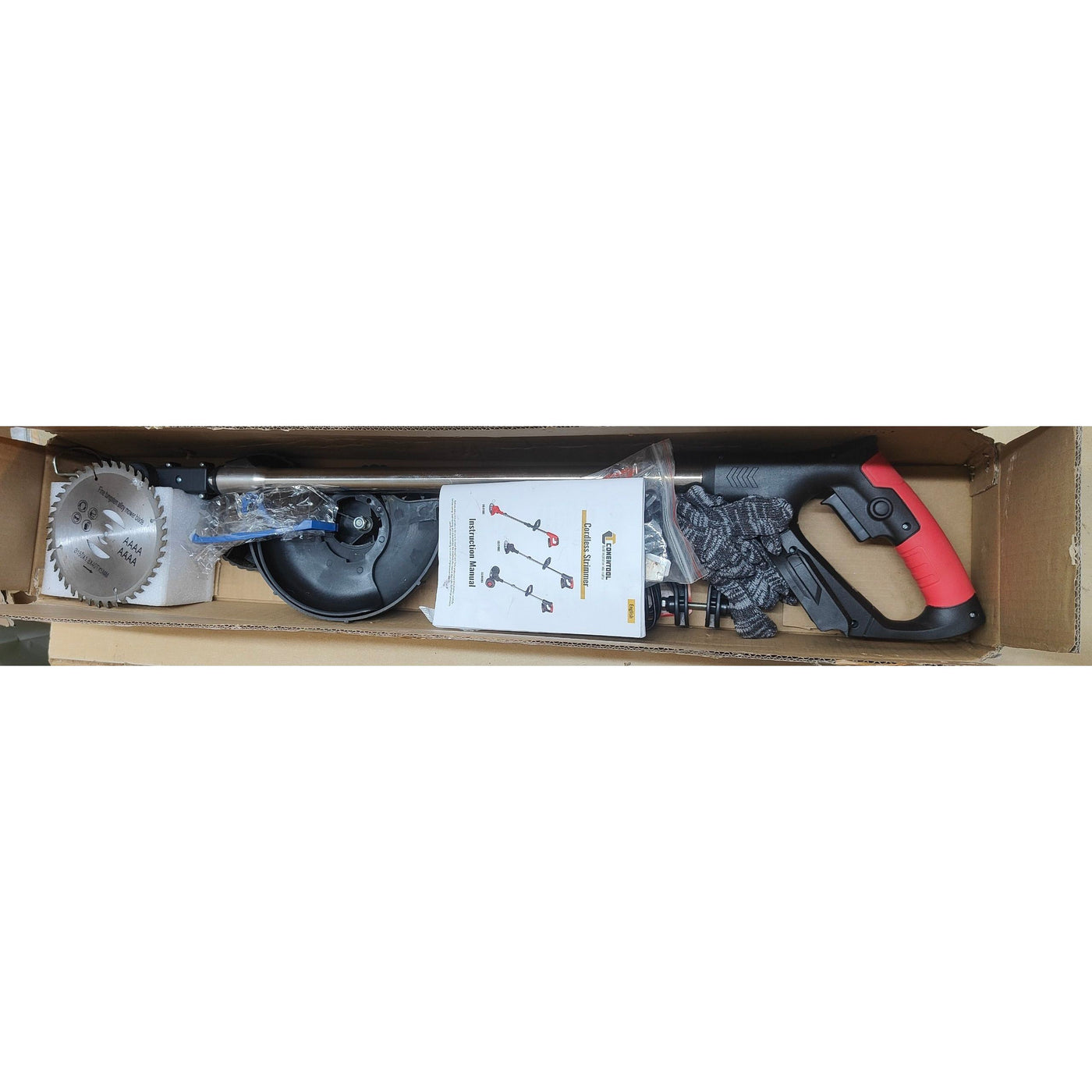Box containing a circular saw, blade, and other tools on a white background