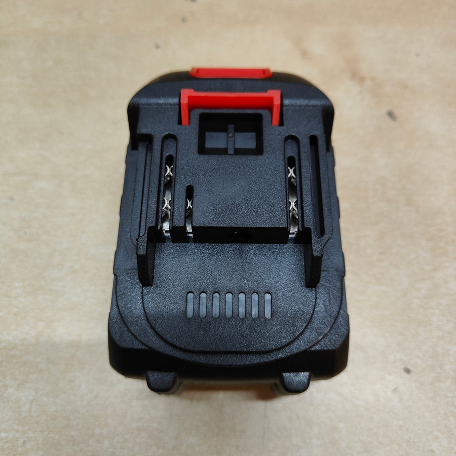 Black and red tool attachment on a beige background