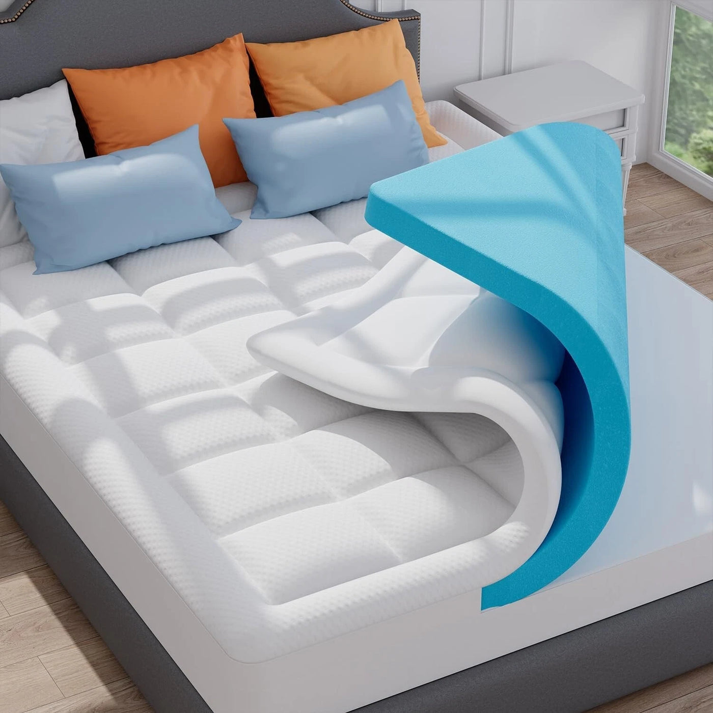 Mattress topper on a bed with pillows in a bedroom setting