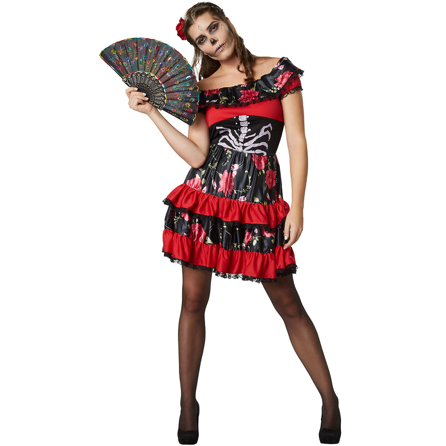 Woman wearing a Halloween costume with a red and black dress featuring skeleton and floral patterns, holding a fan.