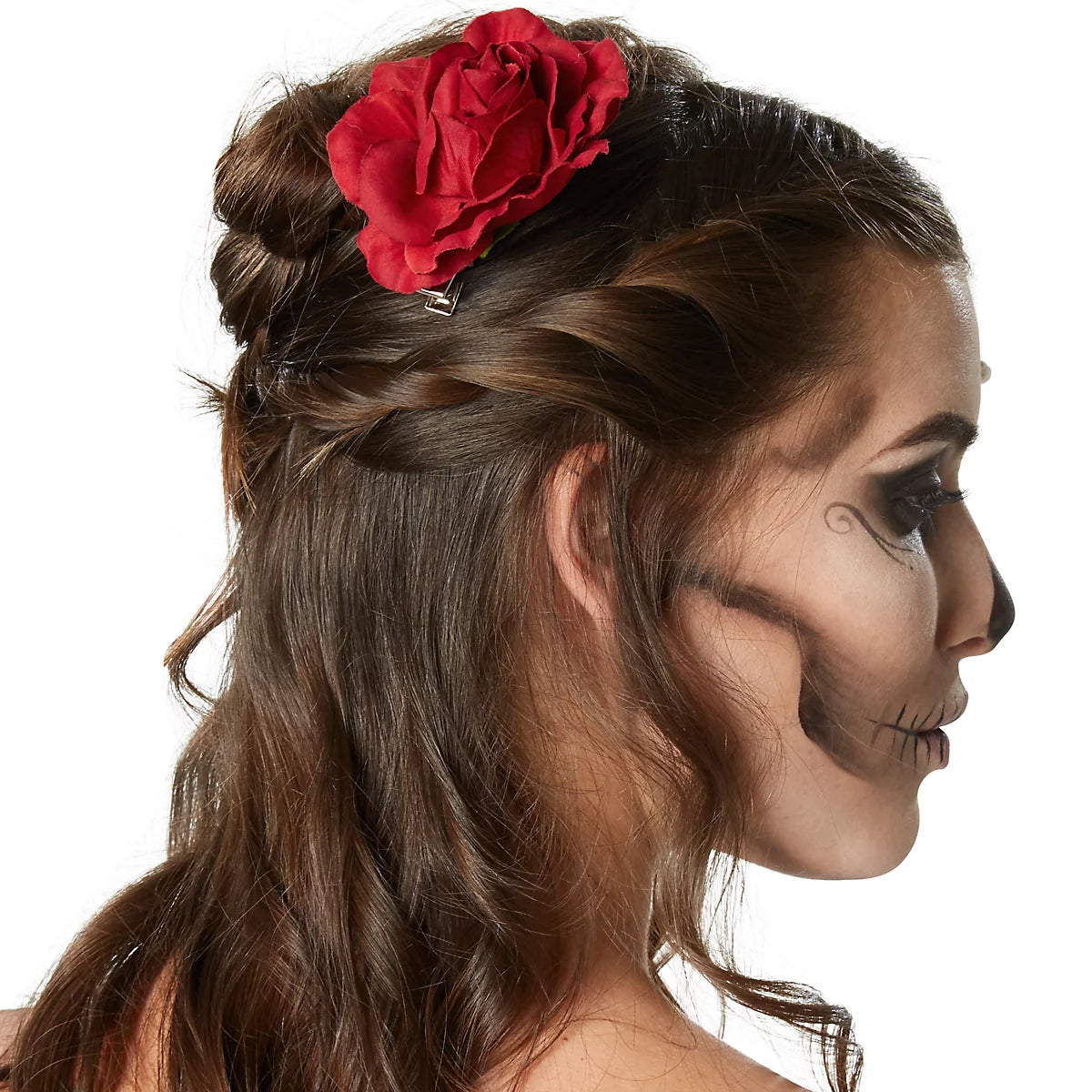 Person with skeleton makeup and a red flower in their hair on a white background